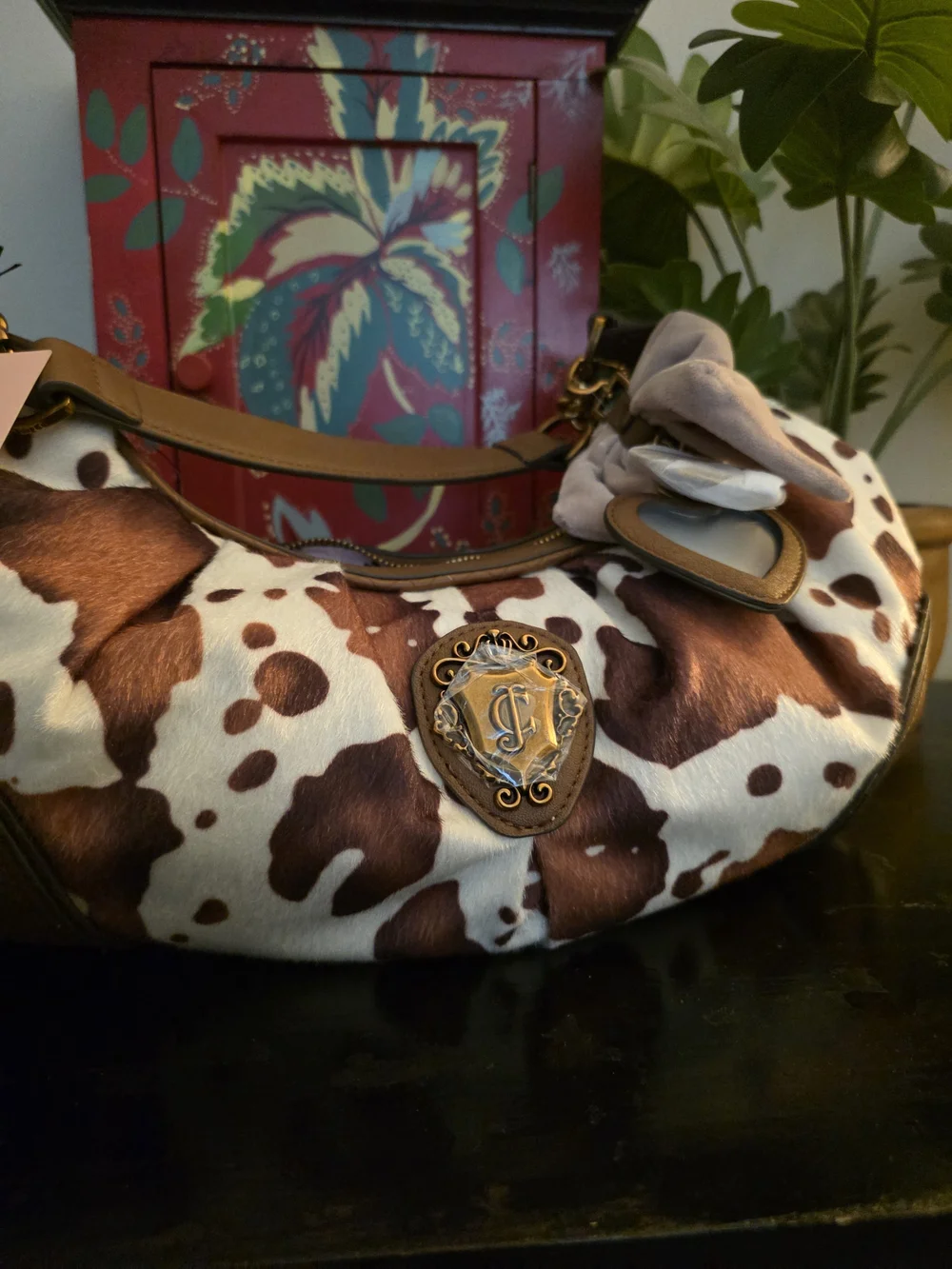 Juicy Couture Saddle Brown & White Cowhide Hobo with Chain Accent